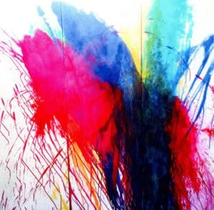 A colorful picture of paint splashing in the air.